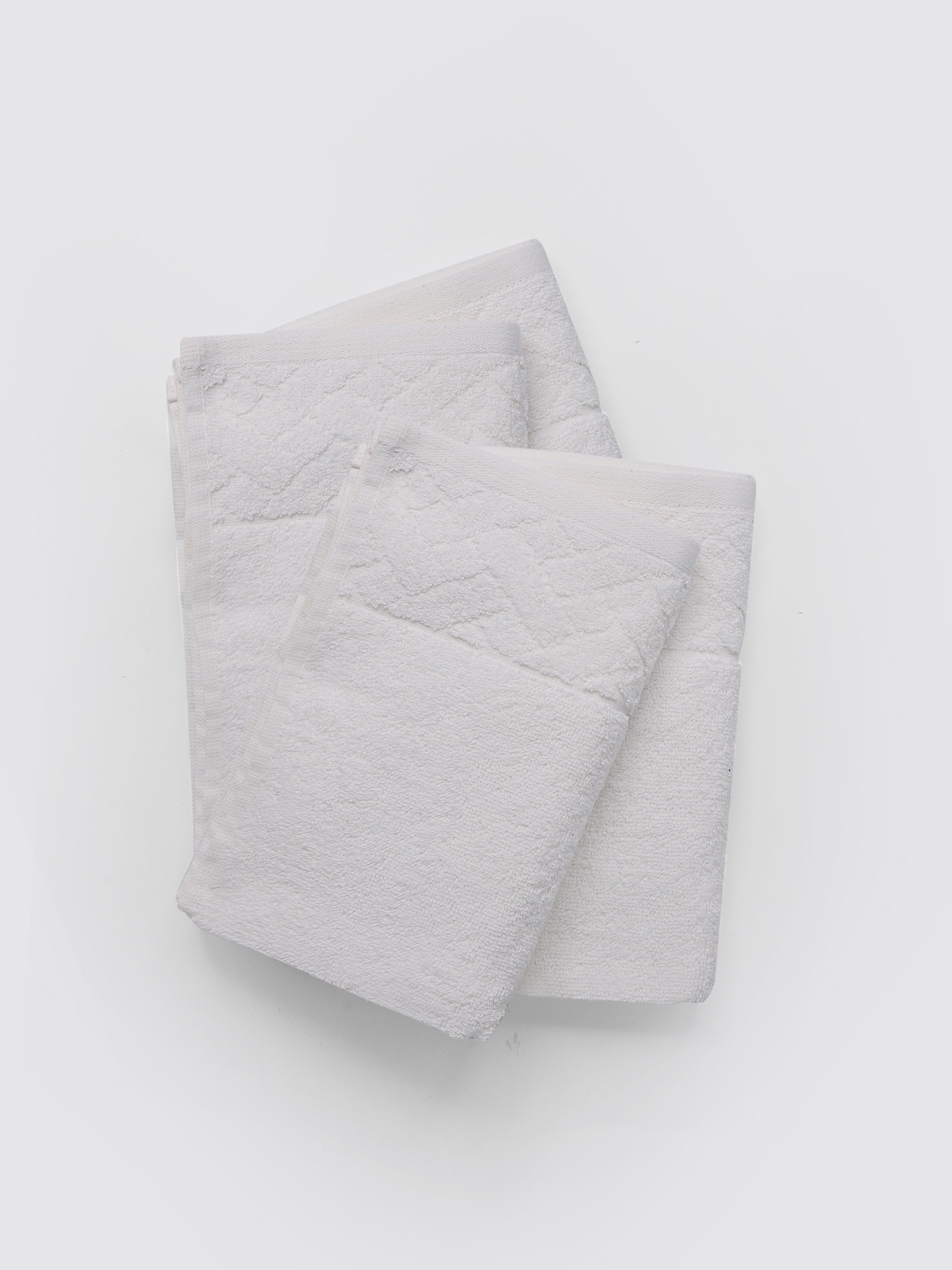 White ring-spun cotton guest towels, pack of 4, 12x20 inches – main product view